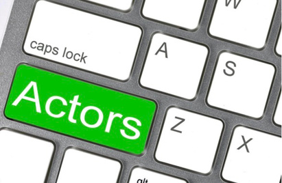 a white buttoned keyboard with the SHIFT key reading Actors colored green  